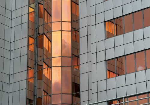 Modern Building with Reflective Orange-Tinted Windows